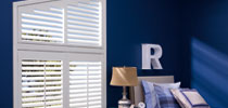 white blinds in blue room